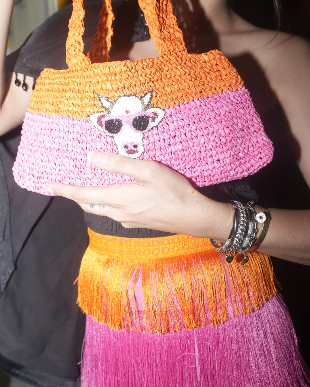 Close-up of The Nandi Bag with raffia texture and Nandi motif